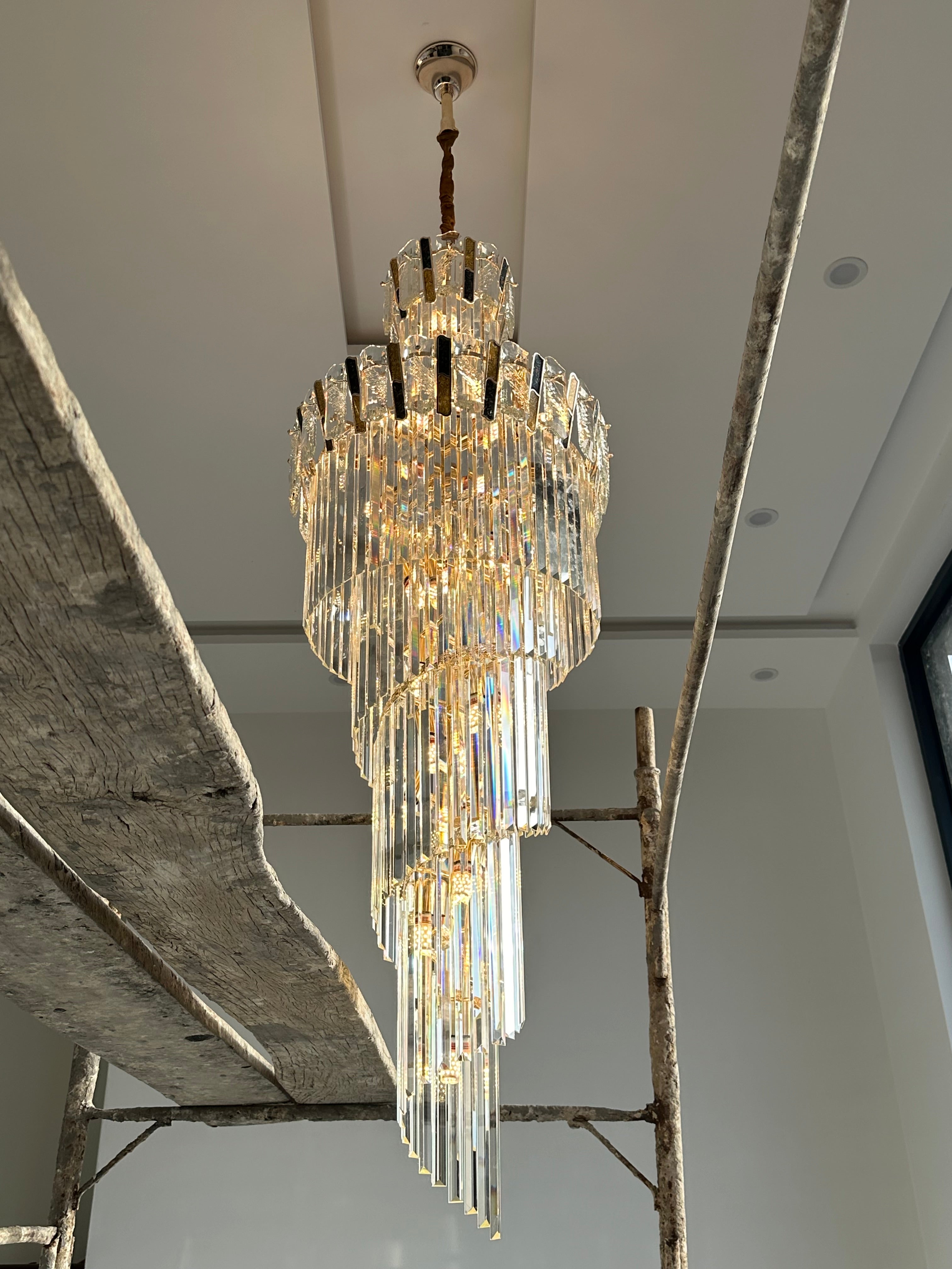 Lightigious Stair Crystal Chandelier warm glow double height staircase